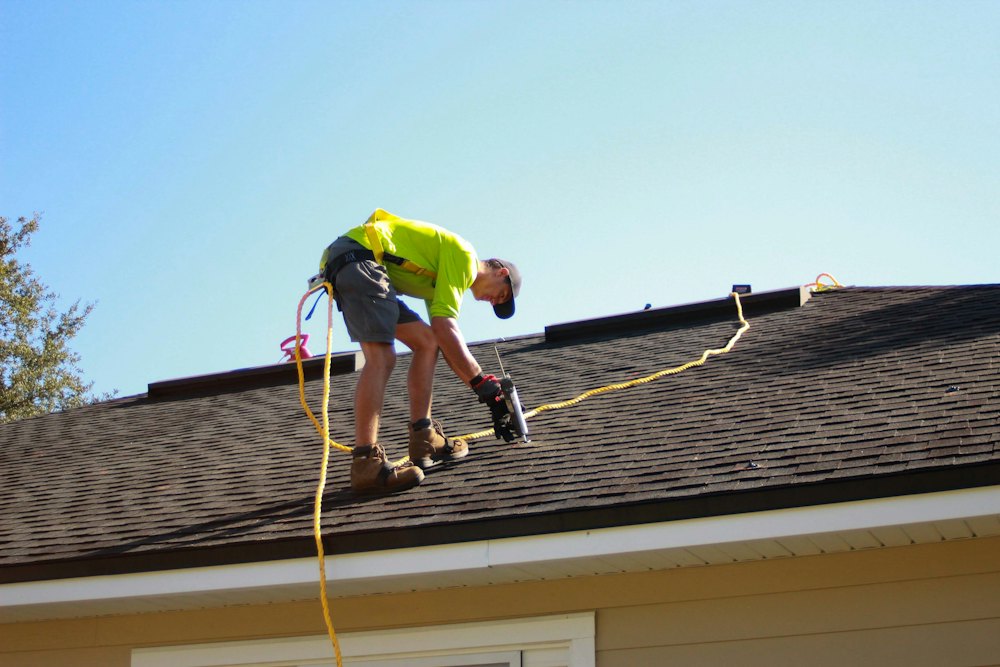 Roofer installing a roof